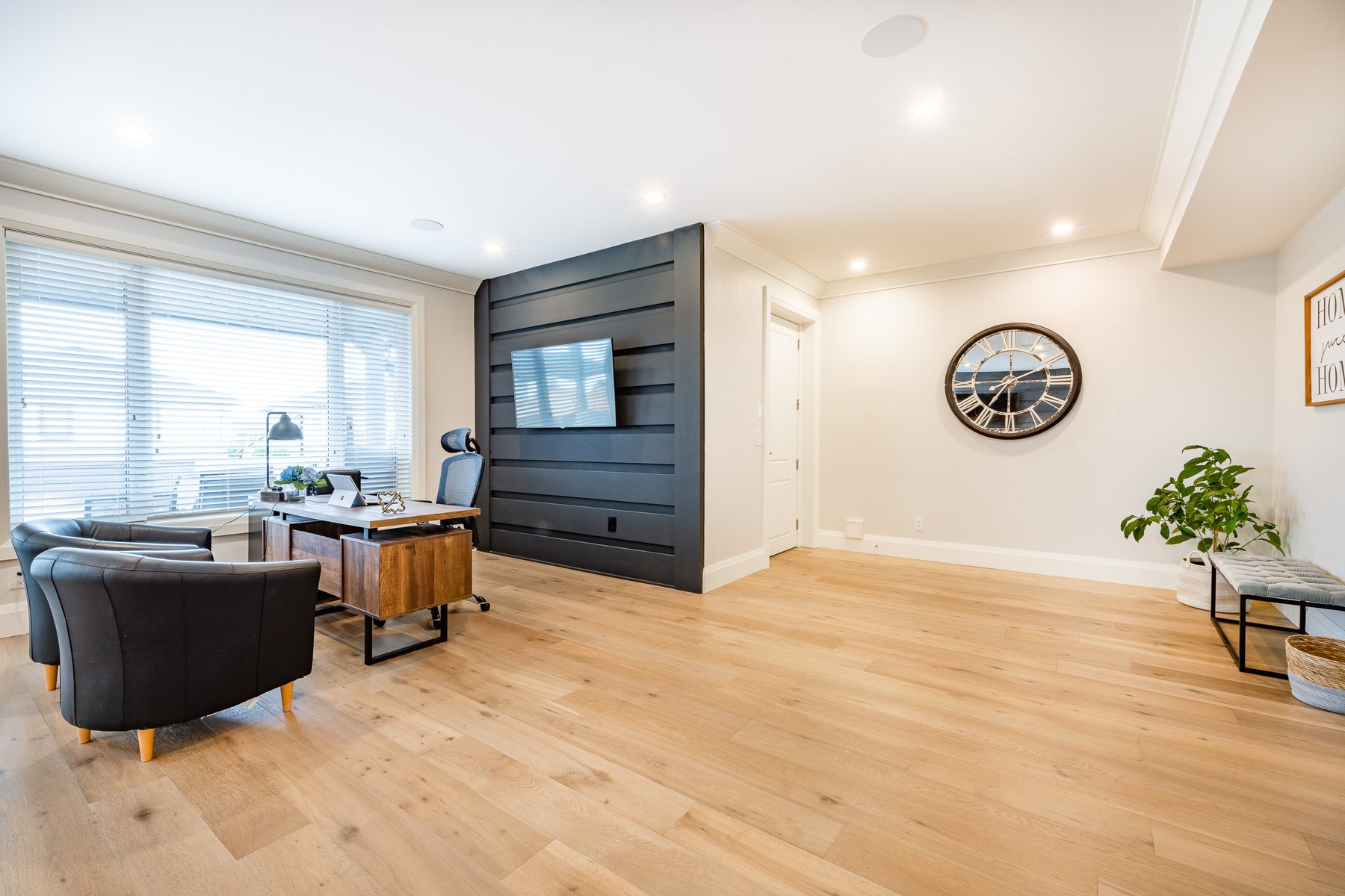 Finished basement living area or suite with natural light