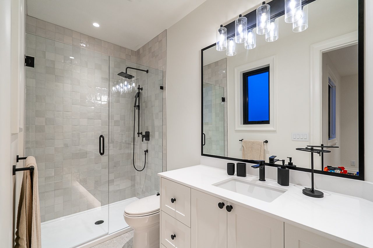 Finished bathroom or living space, wide shot showing tile and millwork detail